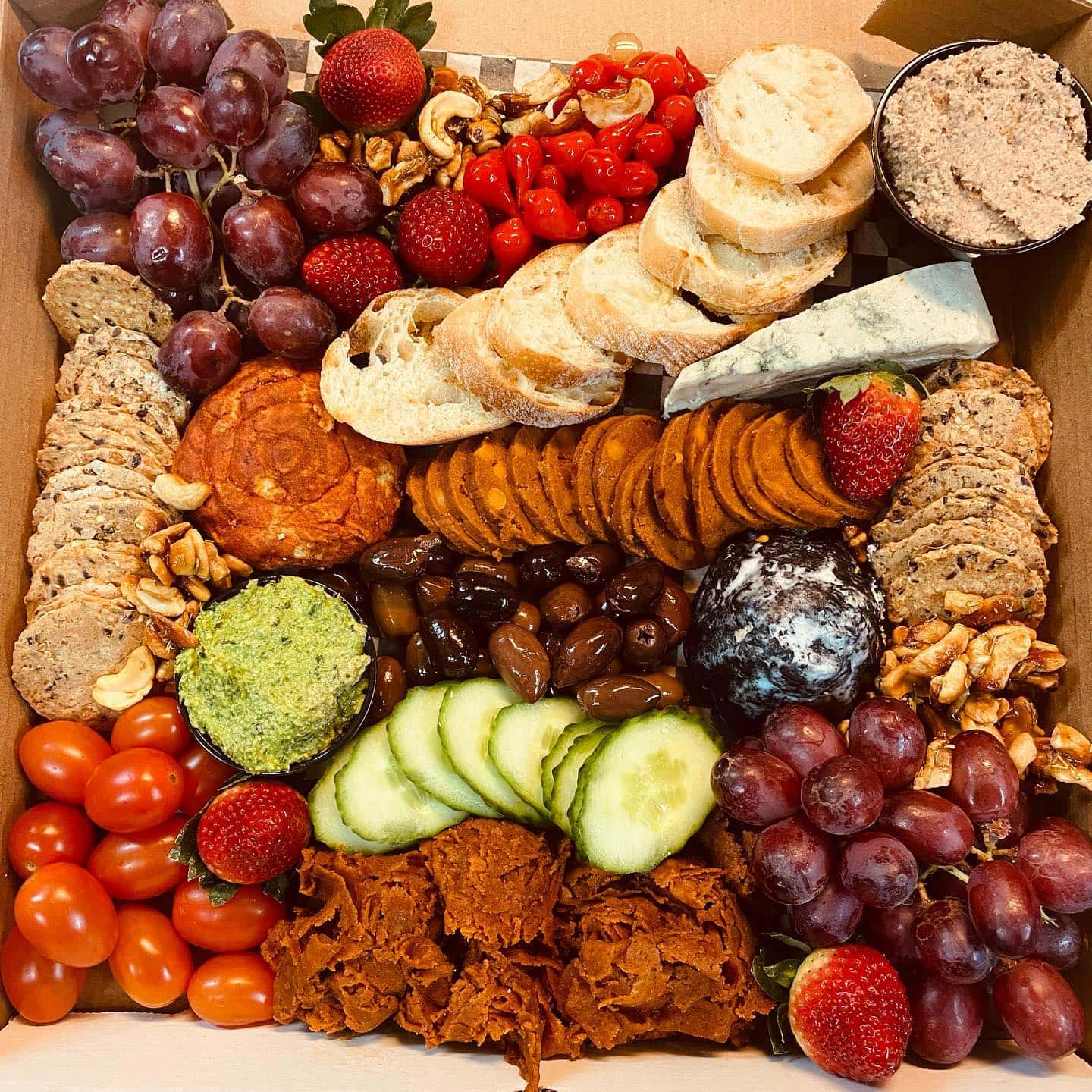 vegan restaurants charcuterie board with vegan cheese and crackers