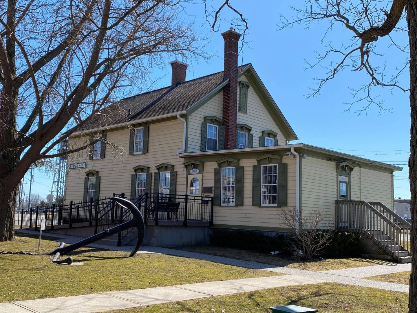 port colborne museum taken from the side. There is an anchor sitting in front of it.