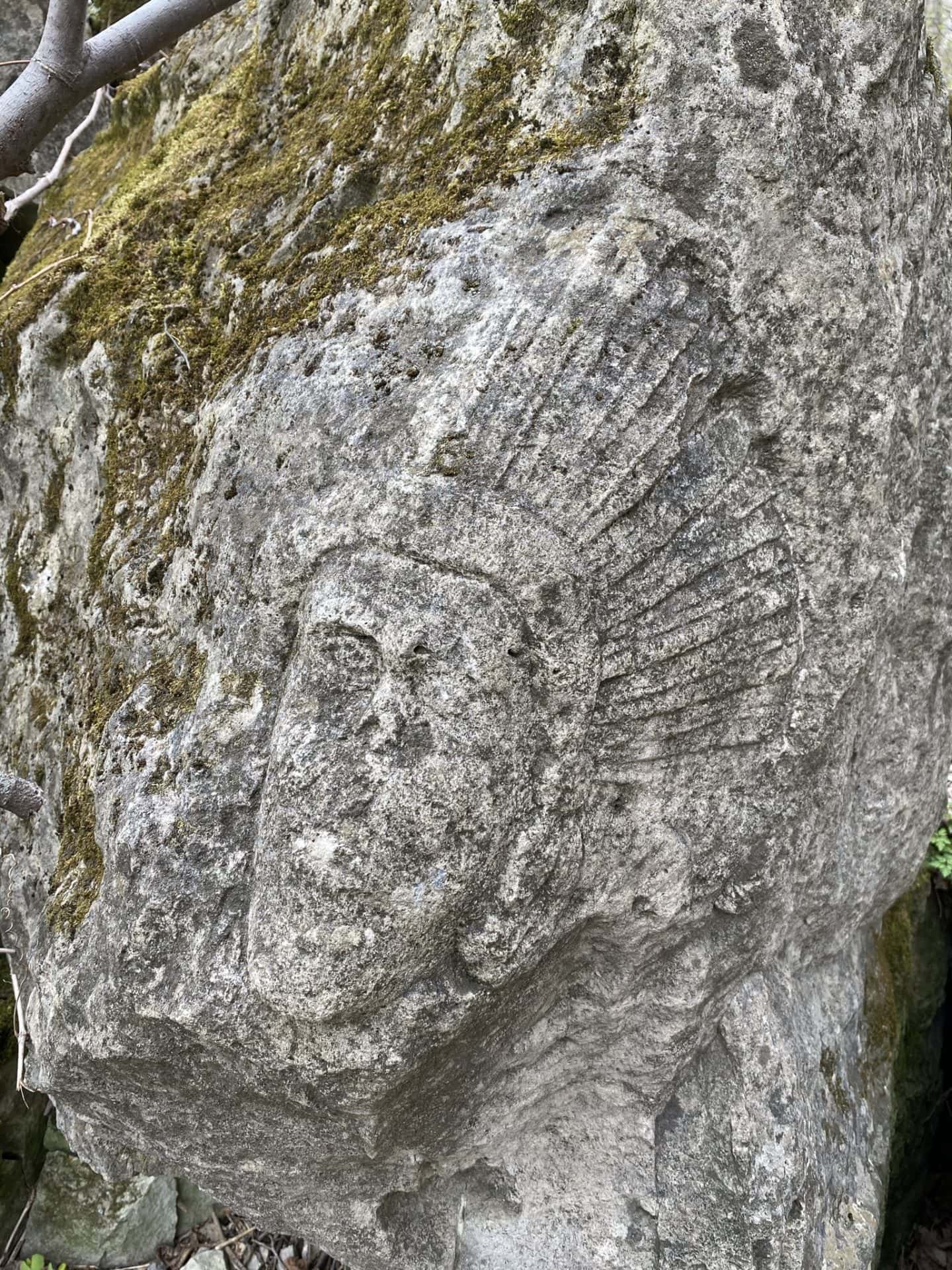 cave springs face in rock carving